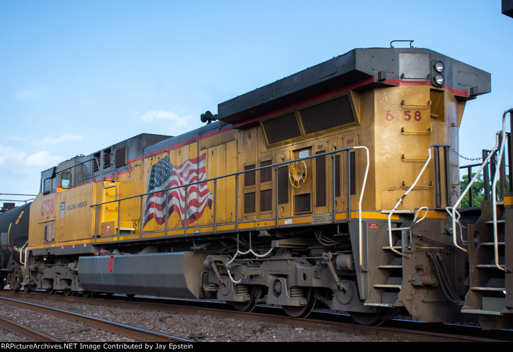 UP 6758 trails on a westbound manifest